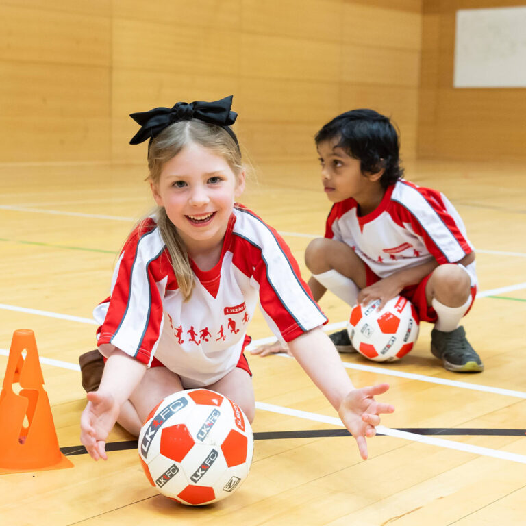 child with soccer ball