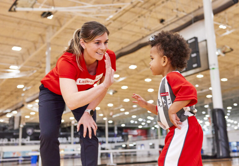 coach and child high-five